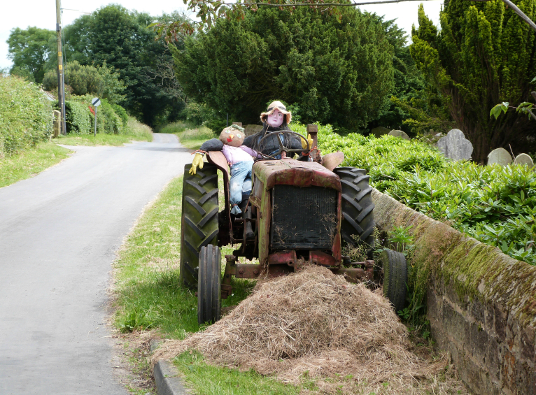 Figures on tractor, Sawley Figures on tractor, Sawley